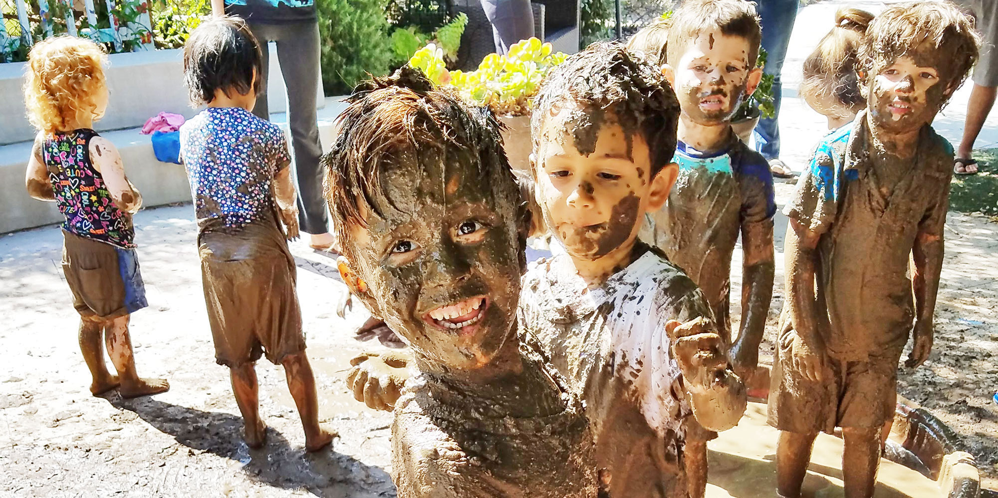 Kids having fun during International Mud Day